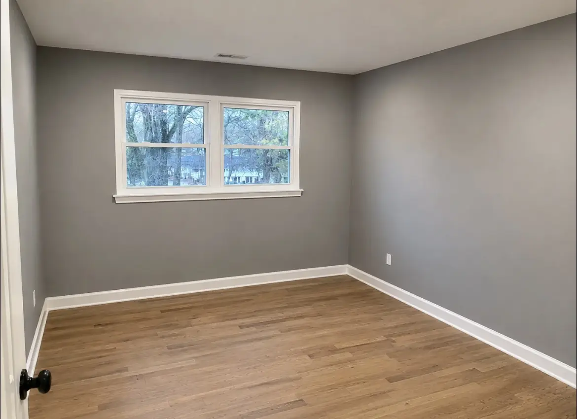 Freshly painted room with new baseboards